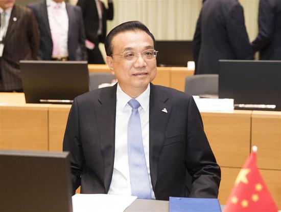 Premier Li Keqiang addresses the 12th Asia-Europe Meeting (ASEM) Summit in Brussels, Belgium, on Oct 19, 2018. (Photo/Xinhua)